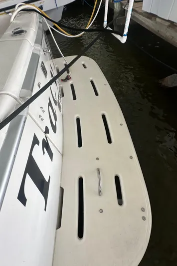 Tracy II Yacht Photos Pics Riviera 350 boat swim platform, 2002 model, docked in marina.