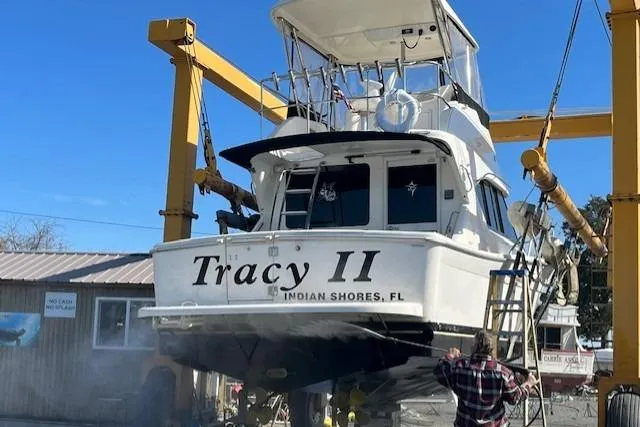 Tracy II Yacht Photos Pics Riviera 350 boat named "Tracy II" being serviced at a dockyard, Indian Shores, FL.