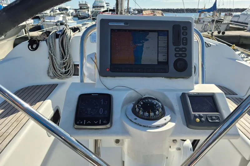 Serene Yacht Photos Pics Cockpit of 2011 Beneteau Oceanis 37 sailboat with navigation instruments and compass.