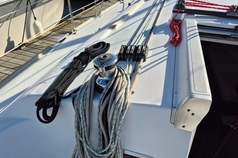 Serene Yacht Photos Pics Deck of 2011 Beneteau Oceanis 37 sailboat with ropes and winch.