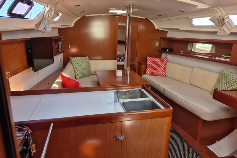 Serene Yacht Photos Pics Interior of 2011 Beneteau Oceanis 37 yacht with cozy seating and modern amenities.
