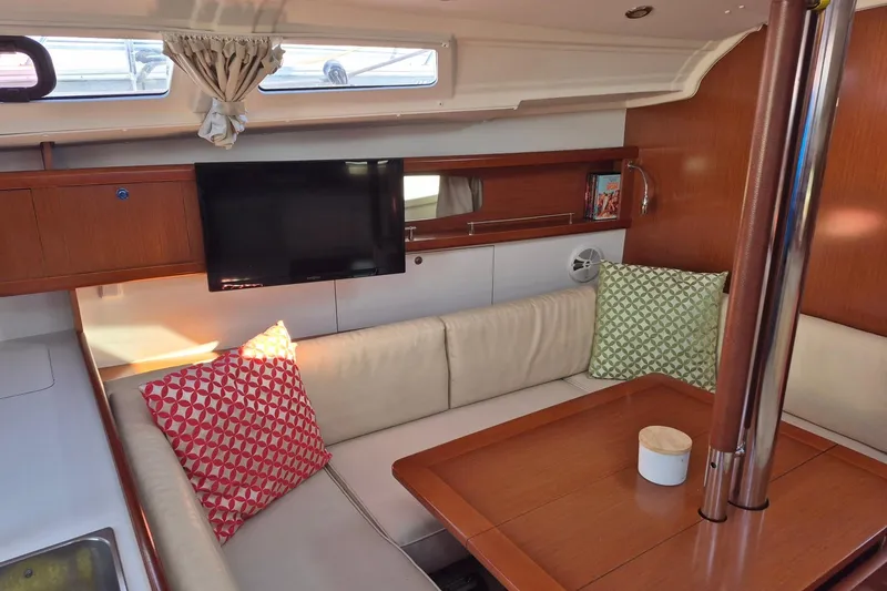 Serene Yacht Photos Pics Interior of 2011 Beneteau Oceanis 37 yacht with cozy seating and modern amenities.
