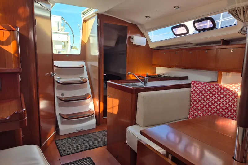 Serene Yacht Photos Pics Interior of 2011 Beneteau Oceanis 37 yacht with wood finish and modern amenities.