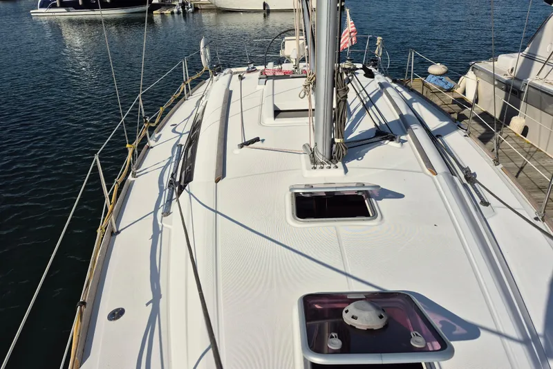 Serene Yacht Photos Pics 2011 Beneteau Oceanis 37 sailboat deck view at marina.