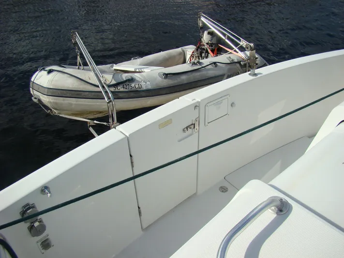 Good Chemistry Yacht Photos Pics 2001 Mainship 430 Trawler with dinghy on water.