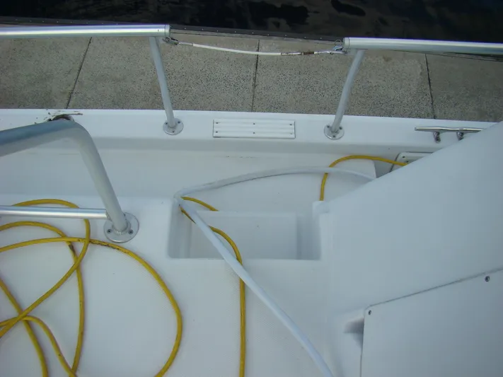 Good Chemistry Yacht Photos Pics Deck view of 2001 Mainship 430 Trawler with yellow and white ropes.