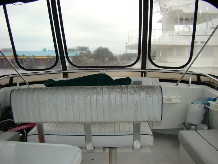 Good Chemistry Yacht Photos Pics Interior view of 2001 Mainship 430 Trawler with seating and windows.