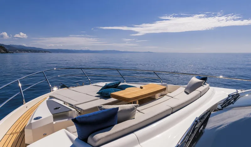  Yacht Photos Pics Luxurious 2026 Absolute 60 Fly yacht deck with sun loungers and ocean view.