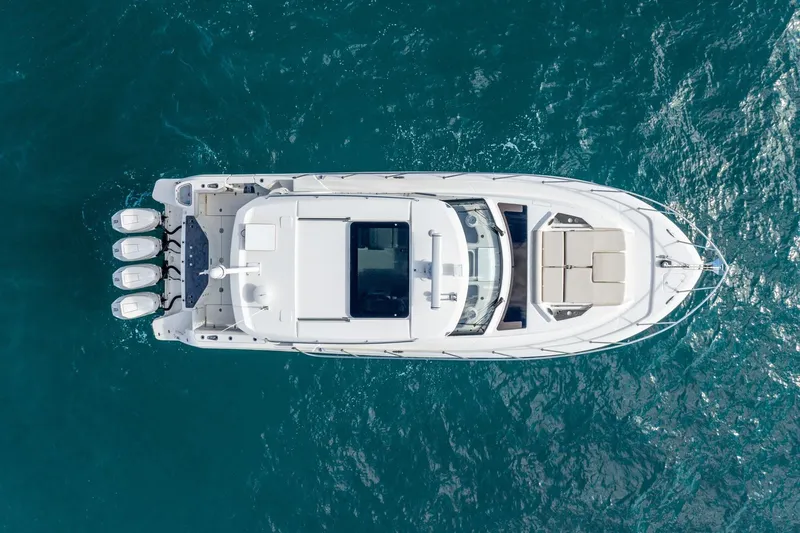 True Companion Yacht Photos Pics Aerial view of 2024 Boston Whaler 405 Conquest yacht on blue ocean water.