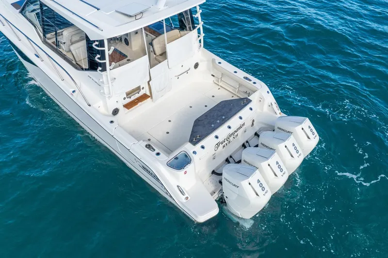 True Companion Yacht Photos Pics 2024 Boston Whaler 405 Conquest boat with four Mercury outboard engines on open water.