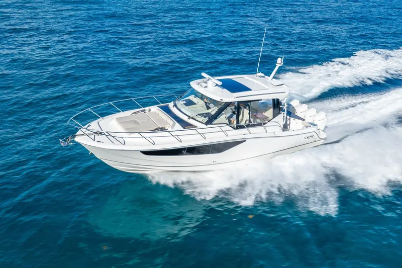 True Companion Yacht Photos Pics 2024 Boston Whaler 405 Conquest cruising on open blue waters.