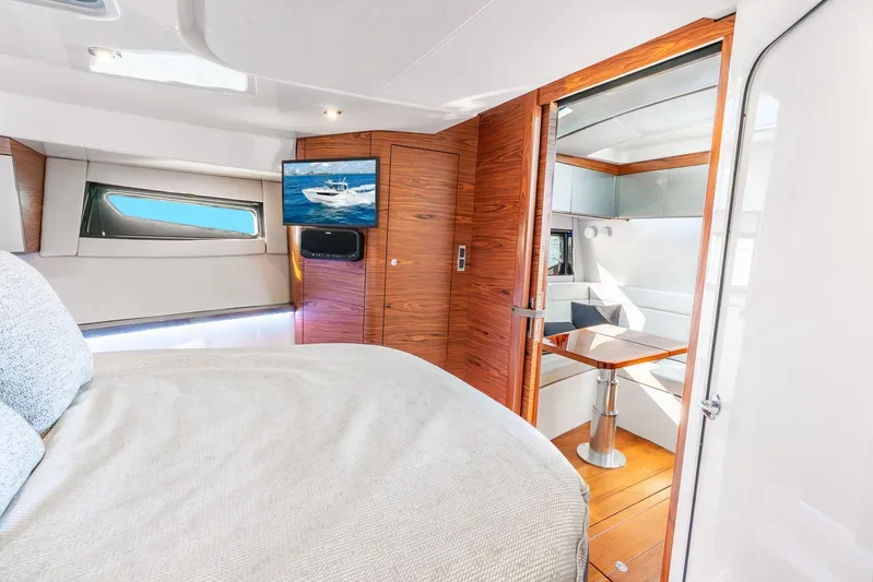 True Companion Yacht Photos Pics Luxurious interior of 2024 Boston Whaler 405 Conquest yacht with modern wood finishes.