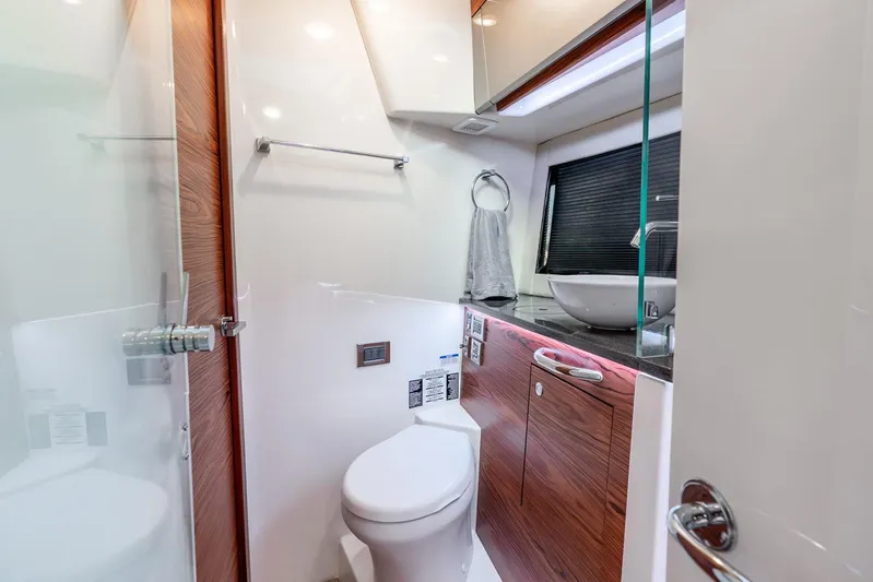 True Companion Yacht Photos Pics Luxurious bathroom interior of 2024 Boston Whaler 405 Conquest yacht, featuring modern fixtures.