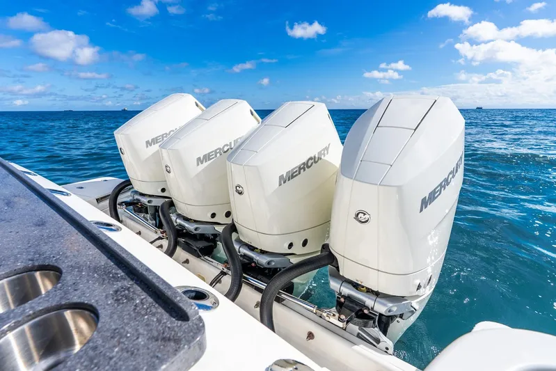 True Companion Yacht Photos Pics Four Mercury outboard engines on a 2024 Boston Whaler 405 Conquest in open sea.