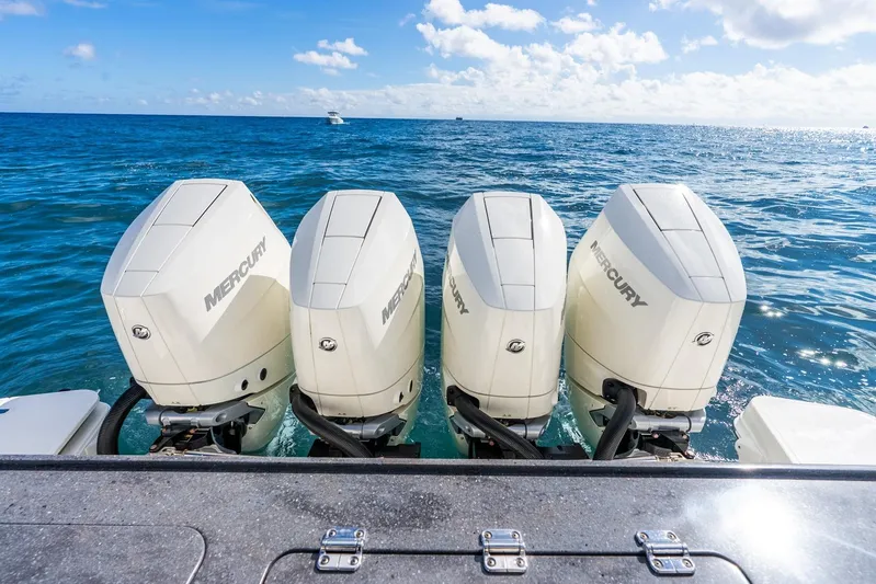 True Companion Yacht Photos Pics Four Mercury outboard engines on a 2024 Boston Whaler 405 Conquest in open ocean.