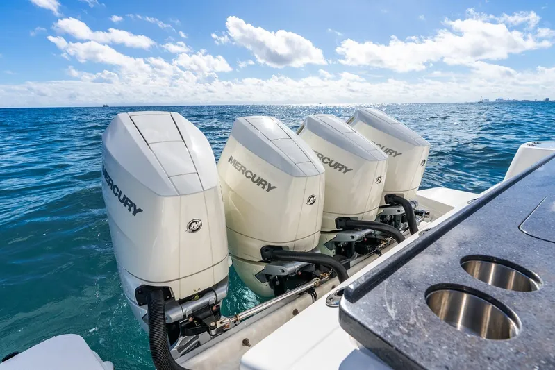 True Companion Yacht Photos Pics Four Mercury outboard engines on a 2024 Boston Whaler 405 Conquest in open water.