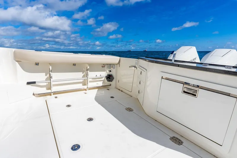 True Companion Yacht Photos Pics 2024 Boston Whaler 405 Conquest boat deck with ocean view and clear sky.