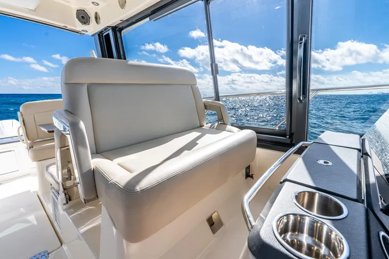 True Companion Yacht Photos Pics Luxurious interior of 2024 Boston Whaler 405 Conquest with ocean view and seating.