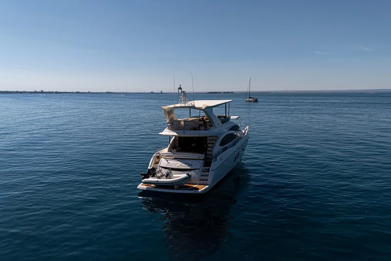 Bar&co Yacht Photos Pics Luxury Sunseeker Manhattan 73 yacht on calm sea, 2008 model.