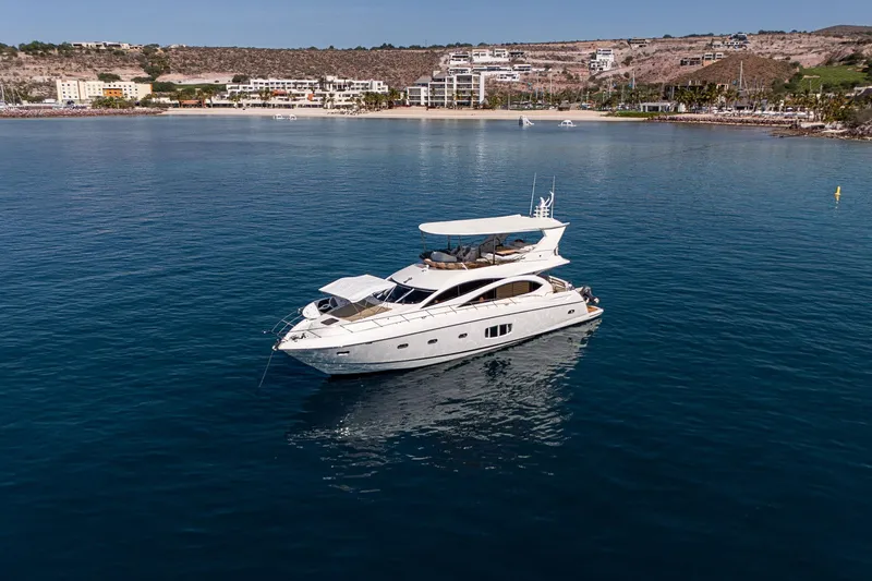 Bar&co Yacht Photos Pics Luxurious 2008 Sunseeker Manhattan 73 yacht on serene coastal waters.