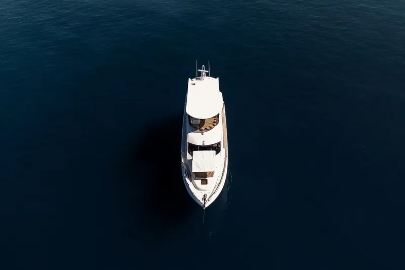 Bar&co Yacht Photos Pics Aerial view of 2008 Sunseeker Manhattan 73 yacht on calm blue water.