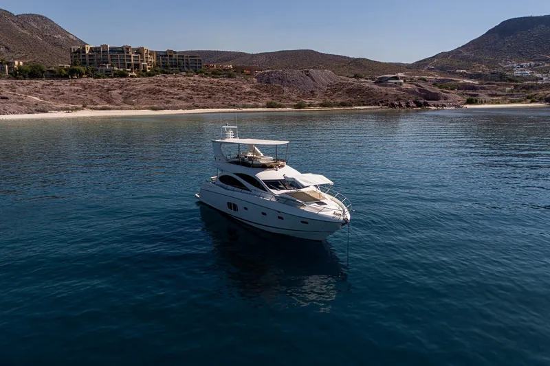 Bar&co Yacht Photos Pics Luxury Sunseeker Manhattan 73 yacht anchored in serene coastal waters, 2008 model.
