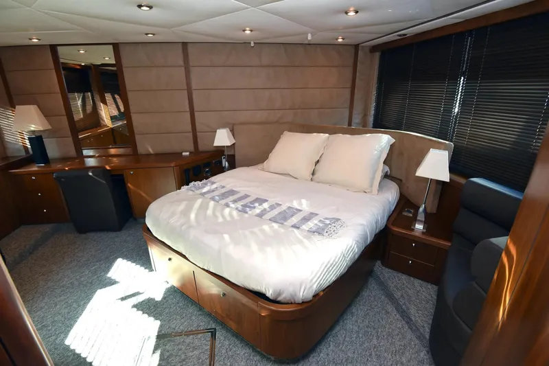 Bar&co Yacht Photos Pics Luxurious bedroom interior of 2008 Sunseeker Manhattan 73 yacht with elegant furnishings.