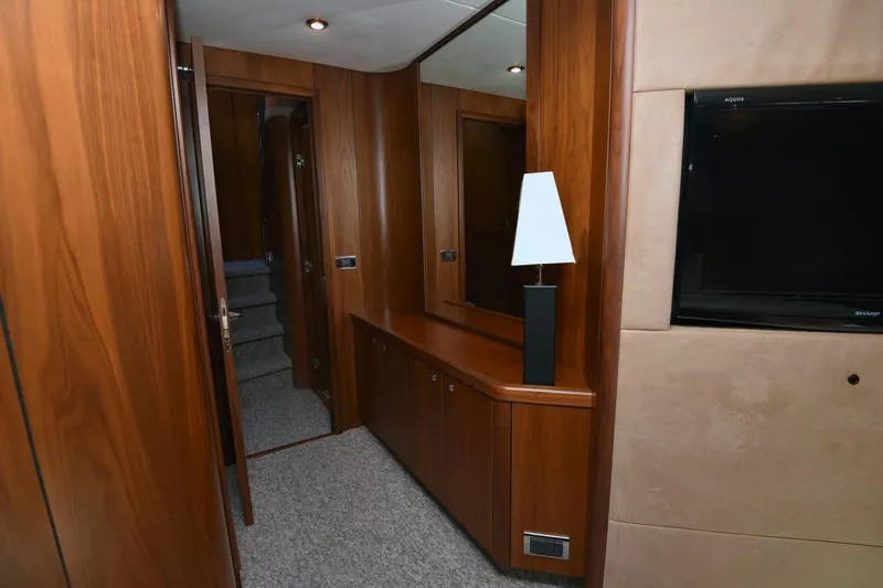 Bar&co Yacht Photos Pics Luxurious interior of 2008 Sunseeker Manhattan 73 yacht with wooden paneling and modern decor.