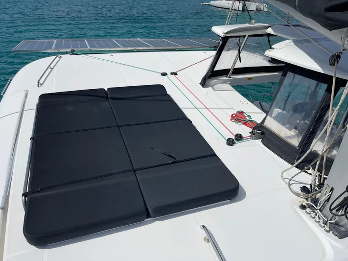 Evolution Yacht Photos Pics 2017 Lagoon 42 catamaran deck with solar panels and seating area.