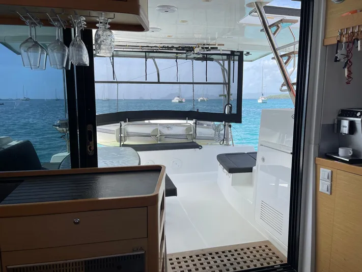 Evolution Yacht Photos Pics Interior view of a 2017 Lagoon 42 catamaran with ocean backdrop.
