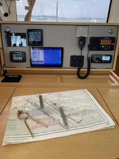 Evolution Yacht Photos Pics Navigation station on a 2017 Lagoon 42 catamaran with charts and instruments.