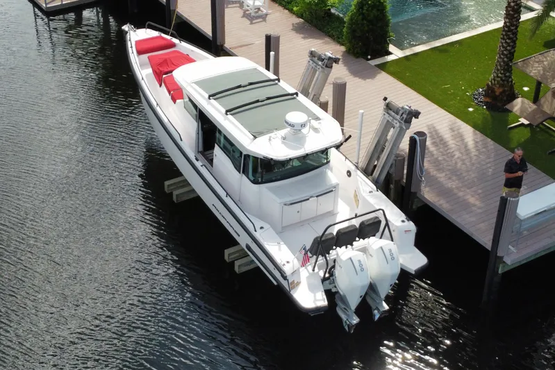 Sweet Spot Yacht Photos Pics 2021 Axopar 37 Cross Cabin boat docked with dual engines and red seating.