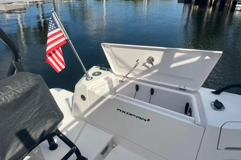 Sweet Spot Yacht Photos Pics 2021 Axopar 37 Cross Cabin boat with open storage and American flag.