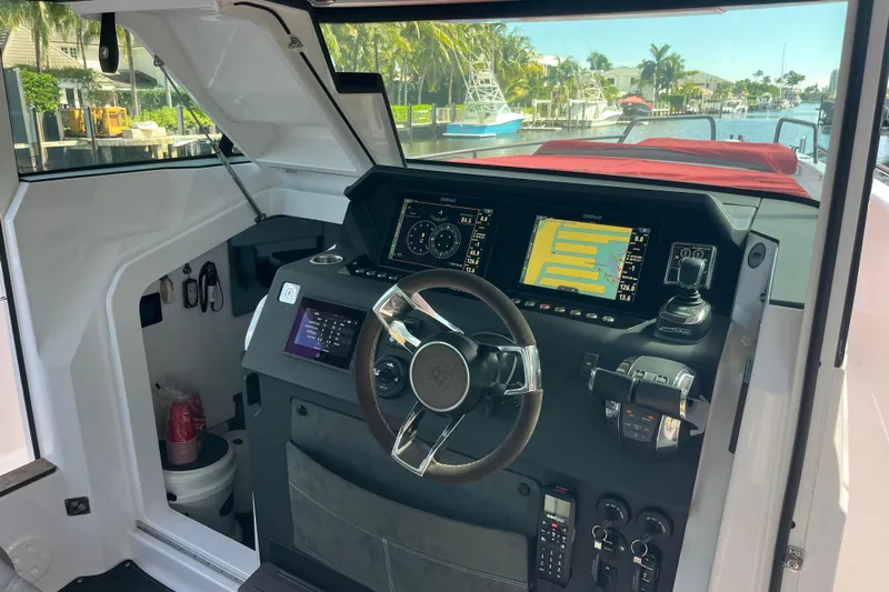 Sweet Spot Yacht Photos Pics 2021 Axopar 37 Cross Cabin helm with modern navigation displays and controls.