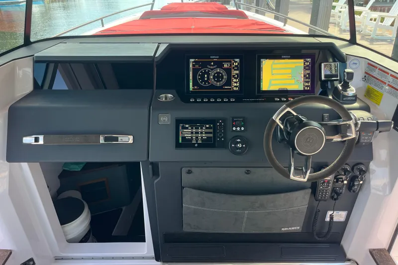 Sweet Spot Yacht Photos Pics 2021 Axopar 37 Cross Cabin helm with advanced navigation displays and controls.
