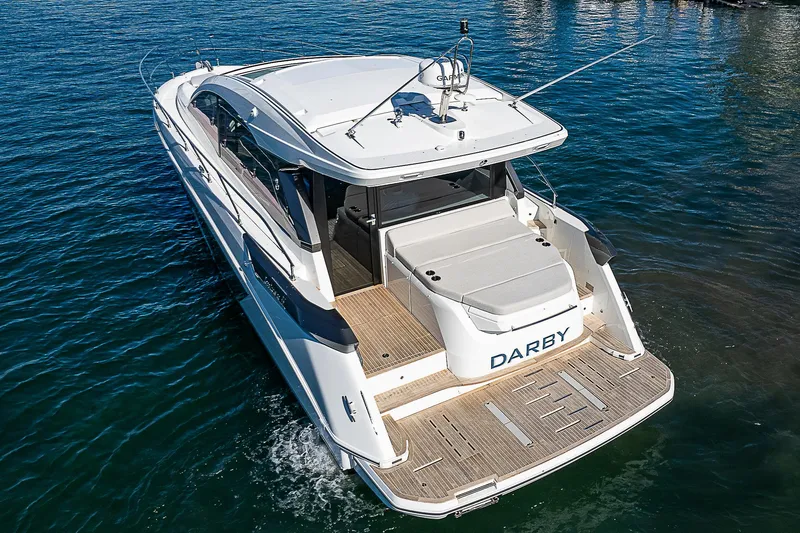  Yacht Photos Pics 2022 Beneteau Gran Turismo 45 yacht on water, rear view.