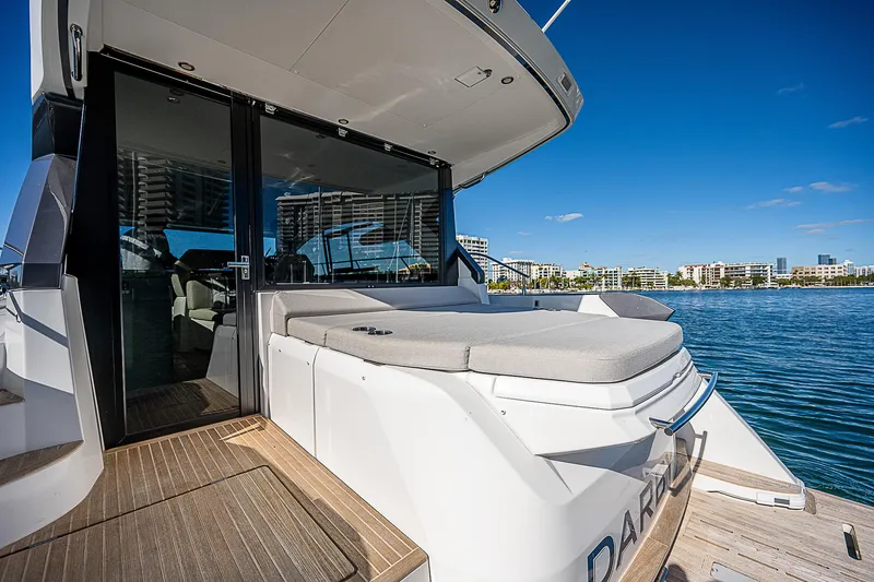  Yacht Photos Pics 2022 Beneteau Gran Turismo 45 yacht with sun deck and waterfront view.