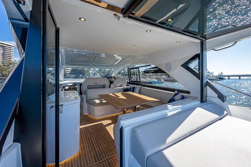 Yacht Photos Pics Interior of 2022 Beneteau Gran Turismo 45 yacht with modern seating and dining area.