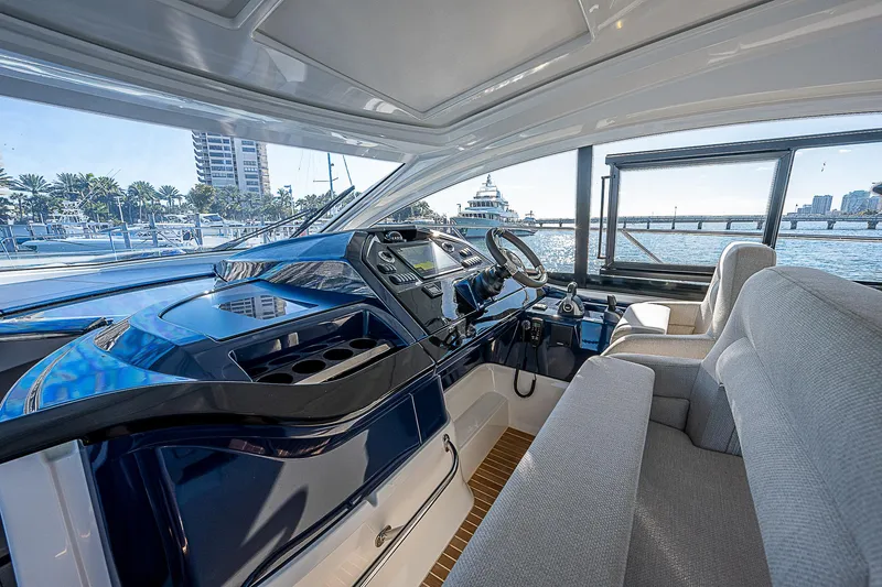  Yacht Photos Pics Interior helm of 2022 Beneteau Gran Turismo 45 yacht with marina view.