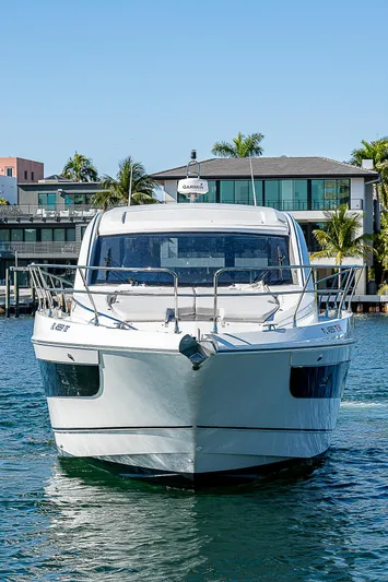  Yacht Photos Pics Beneteau Gran Turismo 45 Yacht 2022 on calm water near modern villa.