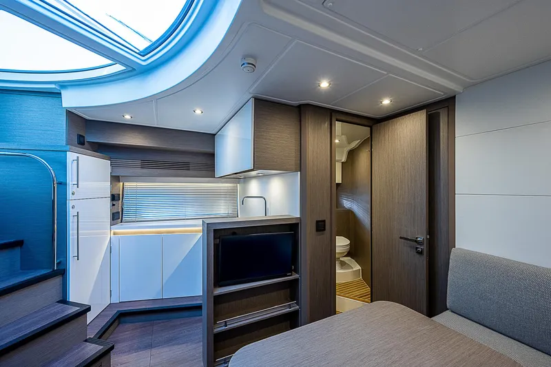  Yacht Photos Pics Interior of 2022 Beneteau Gran Turismo 45 yacht with modern kitchen and cozy living area.