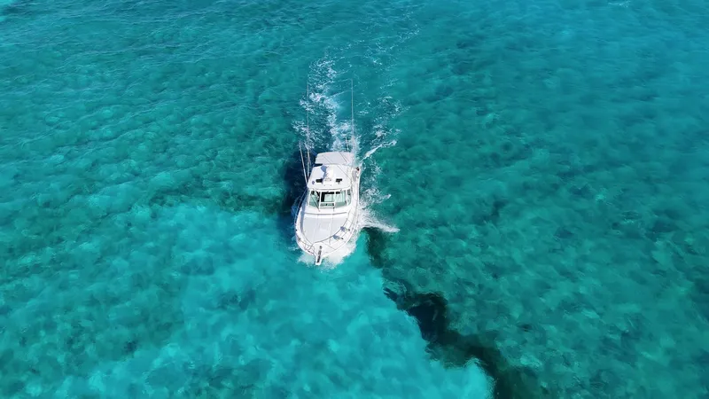 Siboney Yacht Photos Pics Cabo 40 Express 2004 on turquoise water from above.