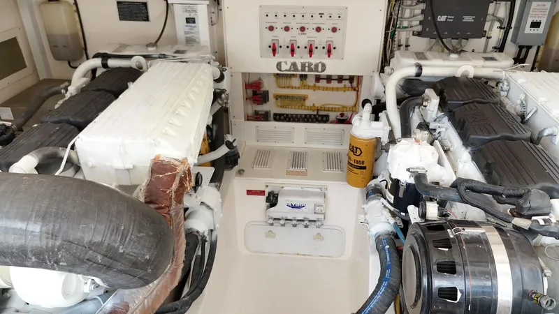 Siboney Yacht Photos Pics Engine room of 2004 Cabo 40 Express with CAT engines.