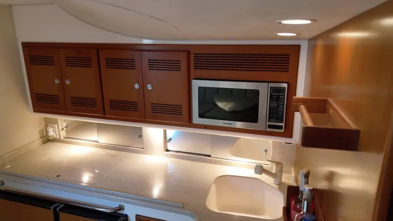 Siboney Yacht Photos Pics Galley kitchen in a 2004 Cabo 40 Express yacht.