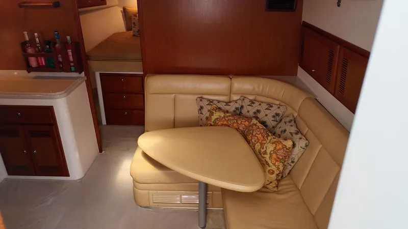 Siboney Yacht Photos Pics Interior of 2004 Cabo 40 Express with seating area and cushions.