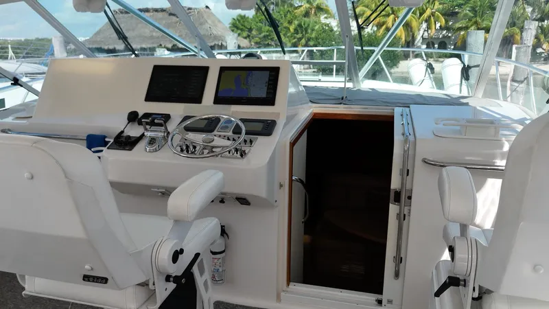 Siboney Yacht Photos Pics Interior view of 2004 Cabo 40 Express yacht cockpit.