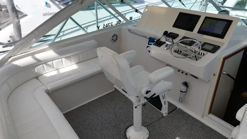 Siboney Yacht Photos Pics Interior of 2004 Cabo 40 Express yacht with helm station.