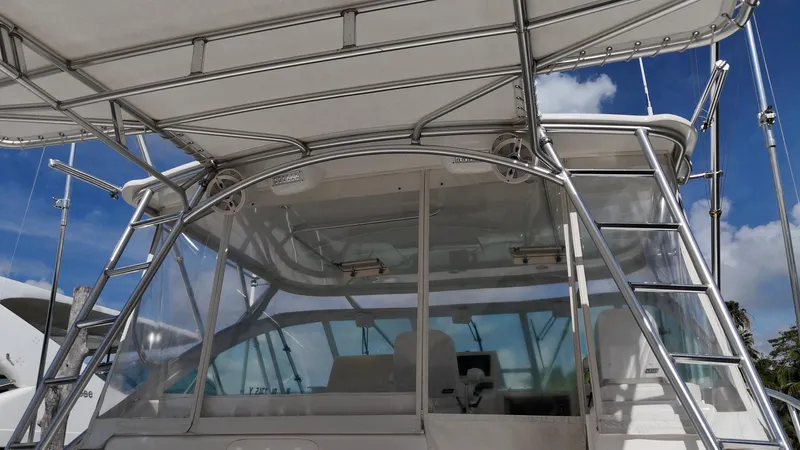 Siboney Yacht Photos Pics Cabo 40 Express 2004 boat with sunshade and ladder.