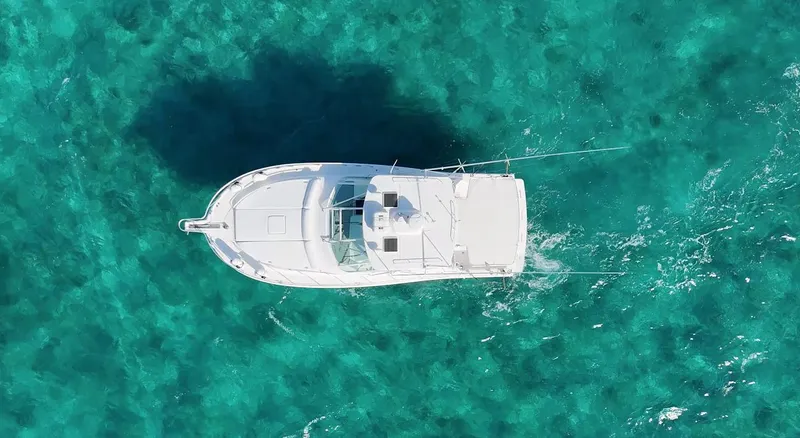 Siboney Yacht Photos Pics Aerial view of a Cabo 40 Express yacht in clear waters.