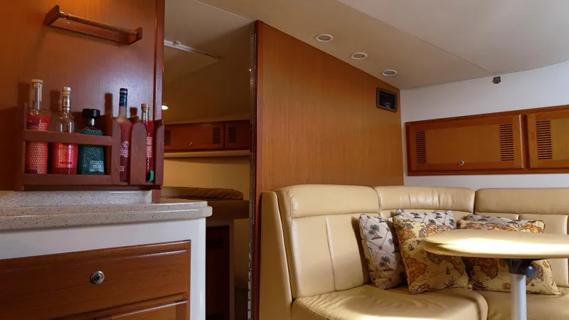 Siboney Yacht Photos Pics Interior of a 2004 Cabo 40 Express yacht with seating area.